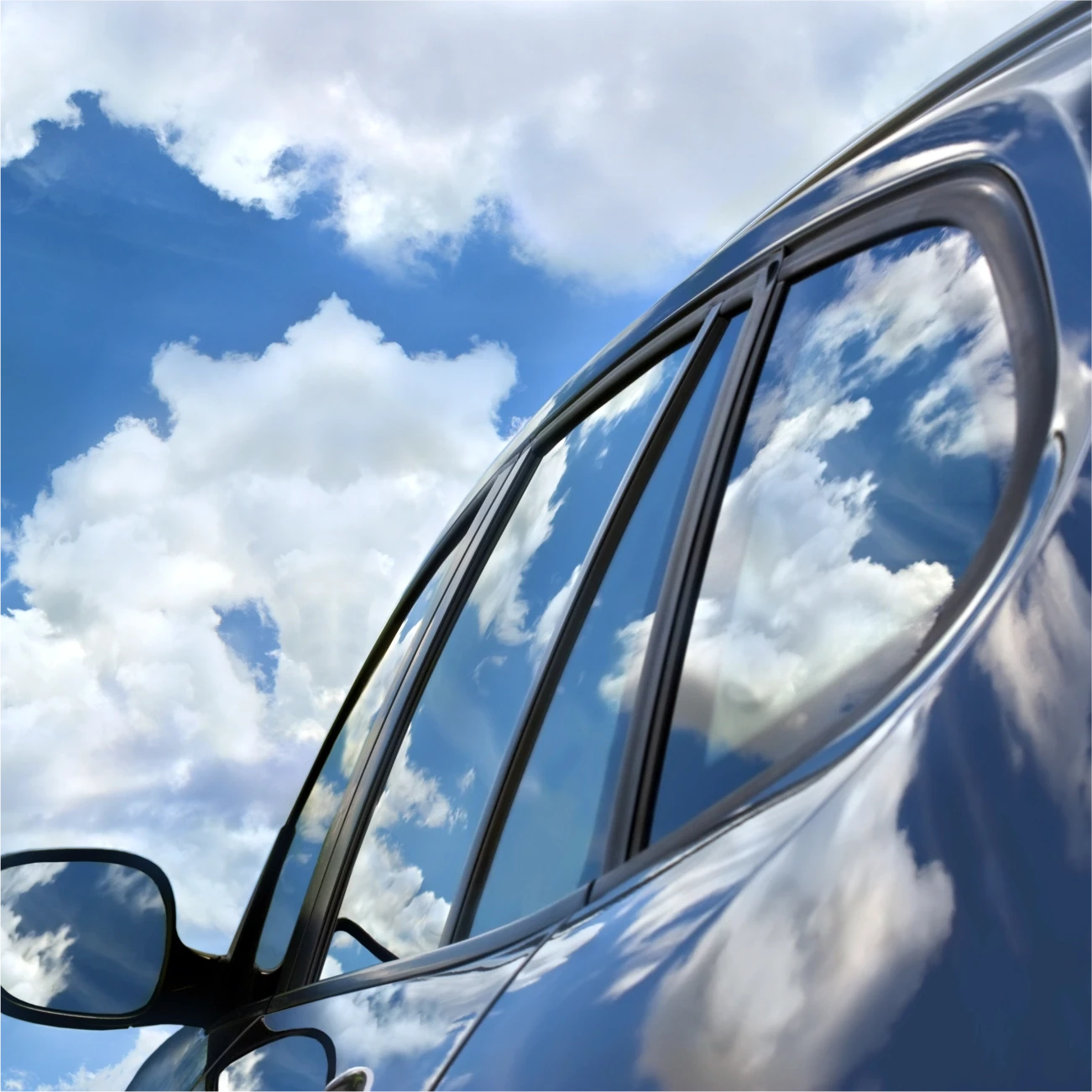 Car exterior reflecting the sky