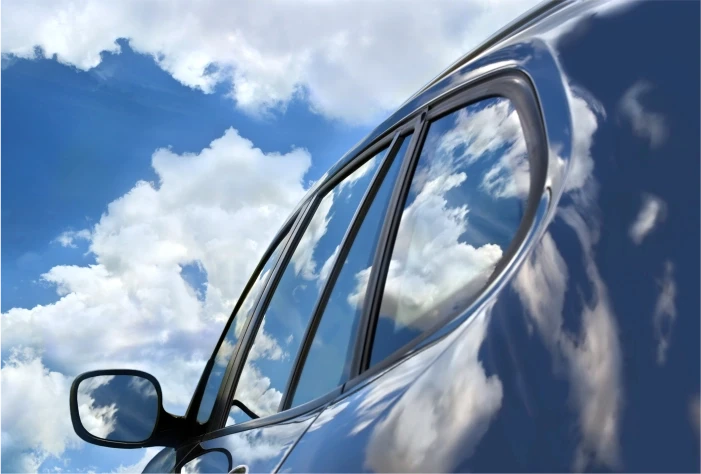 Car exterior reflecting the sky